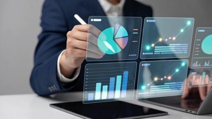 Business analyst using stylus to interact with digital charts and data analytics dashboard in modern workspace
 - Powered by Adobe