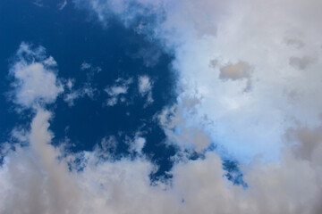 High-altitude cirrocumulus clouds weave a delicate, textured pattern against the deep blue sky, in late summer above Freginals in the province of Tarragona, Catalonia, Spain