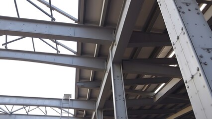 erection. Detailed view of industrial steel beams and columns at a construction site. safety posters, maintenance manuals, designed for precision metalworking and fabrication facilities.