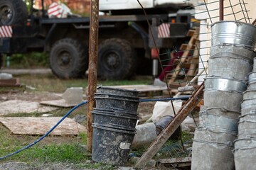 Excavator and construction site from home