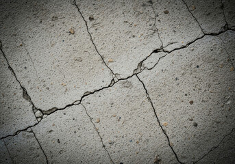Obraz premium Cracked grey concrete wall or floor surface texture background
