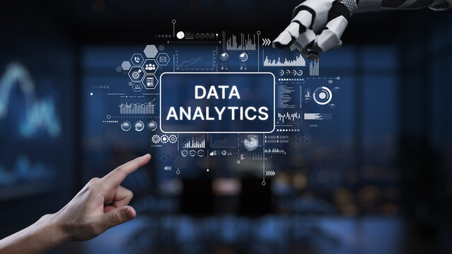 A robotic hand interacts with a data analytics interface, displaying graphs and charts in a modern office, showcasing technology role in data analysis and decision-making. Synapse - Powered by Adobe