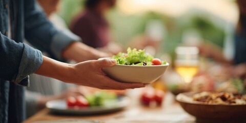 Serving fresh salad at a summer gathering outdoor setting food photography vibrant atmosphere close-up view