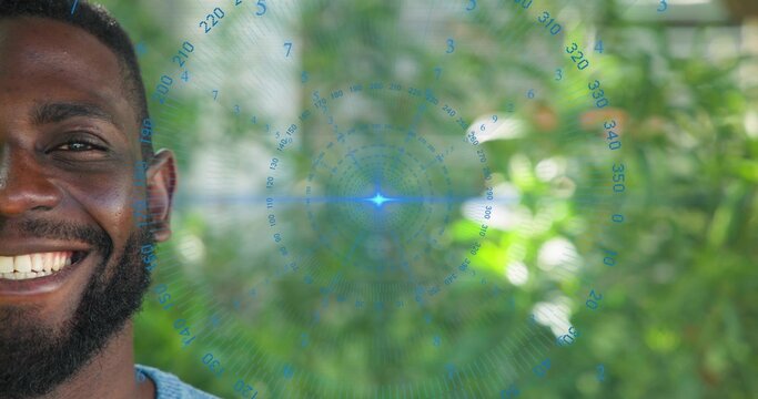 Smiling man wearing light blue knit top showing left face in garden, with HUD, copy space - Powered by Adobe