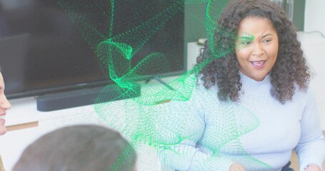 Speaking woman in blue sweater leading meeting in office with TV soundbar green overlay, copy space