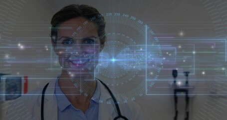 Standing woman doctor facing camera in clinic, wearing white lab coat and stethoscope, HUD overlay