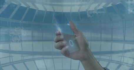 Holding right hand tapping device with glowing UI inside glass dome, thumb flare, wristband visible © vectorfusionart
