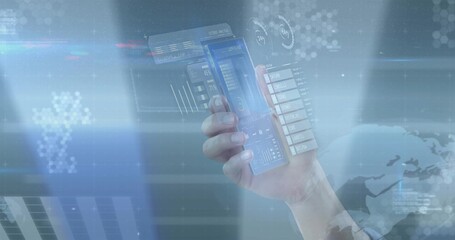 Holding human right hand displaying transparent smartphone in tech workspace, holographic panels © vectorfusionart