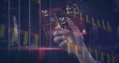 Holding right hand in dark suit sleeve, displaying phone dashboards and trading charts over skyline