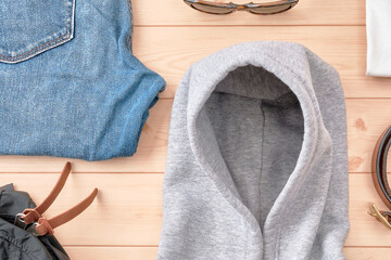 Hoodie and Accessories on Wooden Floor