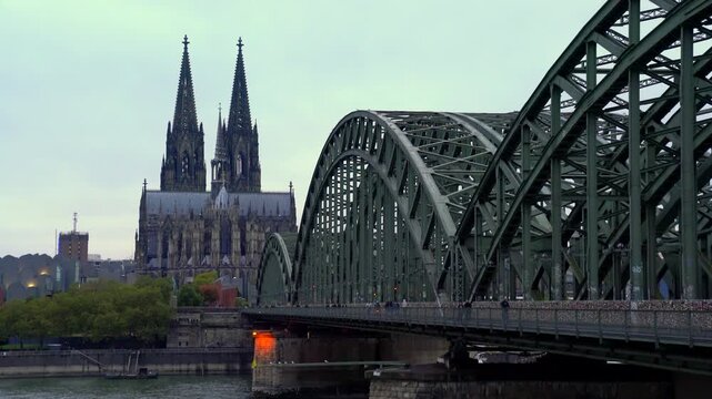Cologne, Germany &ndash; September 24, 2024 &ndash;Historic Hohenzollern Bridge Cologne Cathedral Germany 4K UHD. The Hohenzollern bridge over the Rhine river with the Cologne Cathedral rising in the background. 