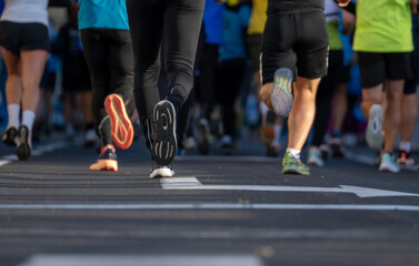 close up of runners feet participating in a marathon race in Ljubljana street