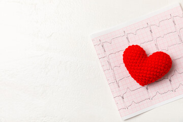 Medical stethoscope, red heart, and cardiogram on a color background. ECG, Heart wave, heart attack, cardiogram report. Cardiogram pulse trace and heart concept. Healthcare.Space for text