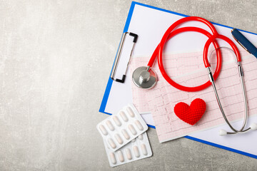 Medical stethoscope, red heart, and cardiogram on a color background. ECG, Heart wave, heart attack, cardiogram report. Cardiogram pulse trace and heart concept. Healthcare.Space for text
