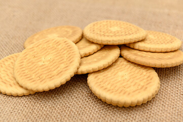 Round vegetarian cookies on burlap. A healthy and delicious dessert.