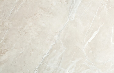 High-resolution beige marble texture with natural veins and smooth stone surface, ideal for luxury interiors, product backgrounds, architecture design, and elegant decorative compositions.