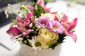 Soft focus on mixed flowers in gentle light. Beauty of nature, tenderness, and freshness in home atmosphere.