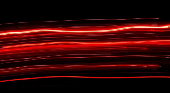 Abstract red light trails motion blur on black background, speed energy concept illustration