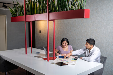 Business colleagues discussing project ideas in modern office