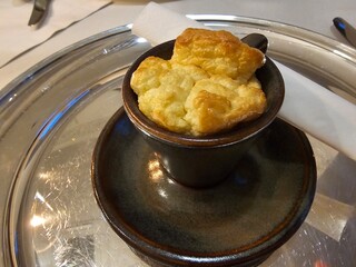 Delicious freshly baked cheese souffl served in small dish on silver tray concept