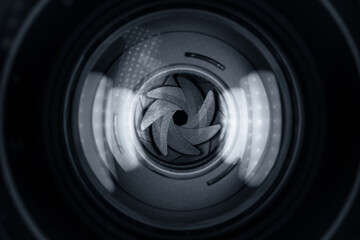 Black camera lens aperture blades closeup
