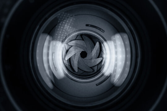 Black camera lens aperture blades closeup