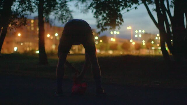 In this park scene, a man symbolizes freedom, starting with outstretched arms, then jumping rope and running spiritedly, blending tranquility and vibrancy