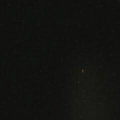 Fototapeta premium Abstract dark background with scattered small white dots creating a subtle starry or speckled effect