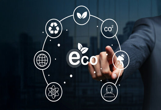 Businessman Interacting with Eco-Friendly Icons Representing Sustainability, Environment, and Green Technology in Modern Office Setting