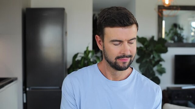 Handsome man doing random things at home 
