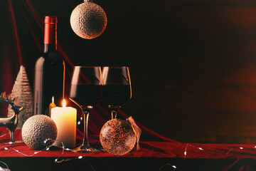 Christmas balls, wine and festive decorations. Happy Holidays greeting card