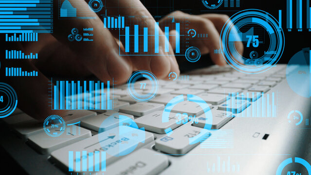 A focused shot of hands typing on a keyboard, layered with vibrant data visualizations. Ideal for business technology and analytics themes. Xenic - Powered by Adobe