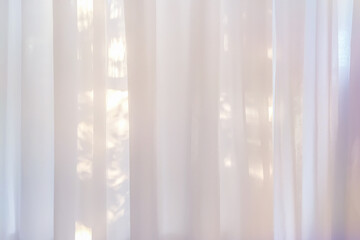 background of white transparent curtains illuminated by soft sunlight. Hazy glow and subtle shadows.