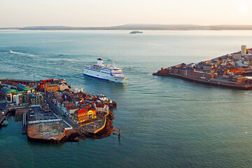 Ferry entering Portsmouth Habour at sunset in Hampshire, UK