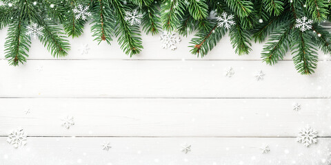 Winter holiday background with green fir branches, snow, and christmas tree decoration