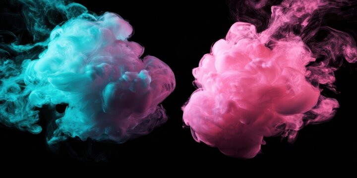 Colorful smoke clouds in teal and pink against black background