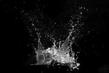Dynamic Water Crown: A striking monochrome photograph captures the ephemeral beauty of a water...