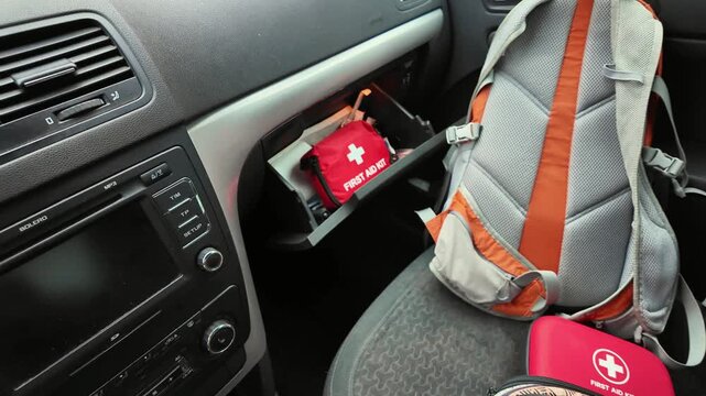 Car emergency supplies, Compact and wellorganized first aid equipment in car cabin, Medical supplies and first aid kit systematically stored inside vehicle for quick access during emergencies