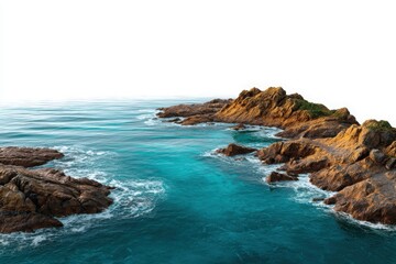 Turquoise ocean waves crash against rugged rocky shoreline under a white sky