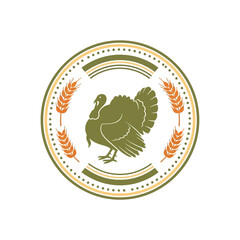 A circular emblem featuring a stylized turkey silhouette surrounded by wheat stalks and decorative borders.