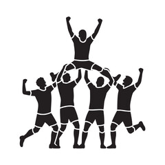 Cheerleaders form a human pyramid celebrating victory