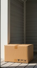 Brown cardboard box sitting on a clean wooden porch awaiting pickup after successful transportation and guaranteed service fulfillment, package, retail, carton