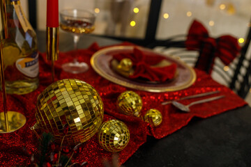 Elegant Christmas Table Setting with Red and Gold Decorations