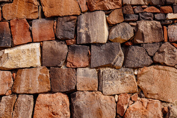 Stone masonry wall natural texture background