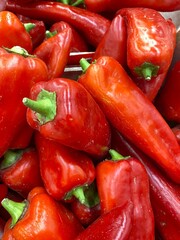 Fresh red bell peppers in a close-up view, showcasing their vibrant color and texture