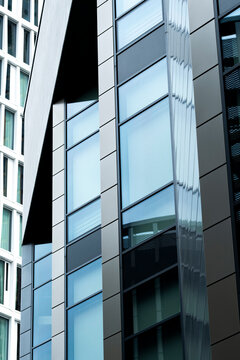 Architectural design of a modern office building in Frankfurt showcasing minimal facade, structural rhythm and urban geometry integrated within the evolving business city environment