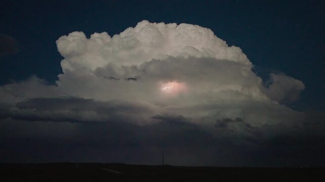 Illuminated sky with powerful lightning bolts during an intense thunderstorm 