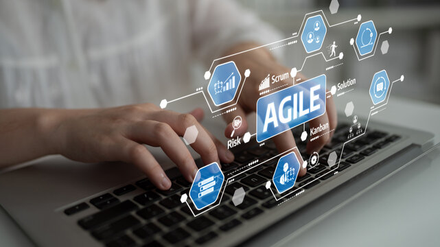 A close-up view of hands typing on a laptop with a digital overlay showcasing agile methodology concepts, emphasizing collaboration and project management tools in an office environment. Tessel