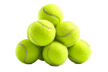 Pile of bright yellow tennis balls on black background
