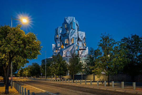Arles, Provence, France &ndash; 09.10.2025: Illuminated Luma tower in Workshop park, Arles at blue hour. 